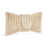 Bolsa clutch feminina de festa com laço e pedrarias, acabamento brilhante em prata ou dourado e alça removível.